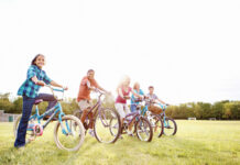 Lucky Bikes Empowers Denver Youth Through Cycling and STEM Children pose on bikes.