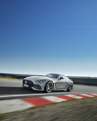 The Mercedes-AMG GT 63 Coupe drives along and open road. 