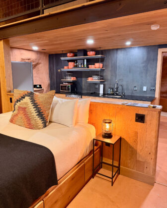 Bed and kitchen at Honey Rock Landing.