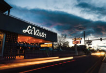 El Piñon’s Winter Rum Punch Recipe Warms Up Colfax Exterior shot of El Piñon & La Vista Motel at night.