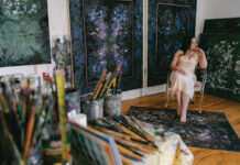 Joon Tajadod Brings Persian Heritage and Feminine Power to Art Artist, Joon Tajadod, poses among her artwork.