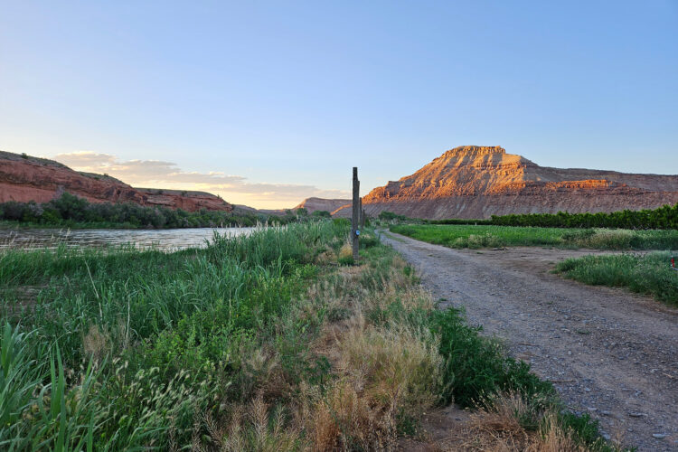 Field and mountain at Honey Rock Landing.