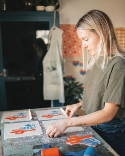 Julie Malone works on her block printing designs.