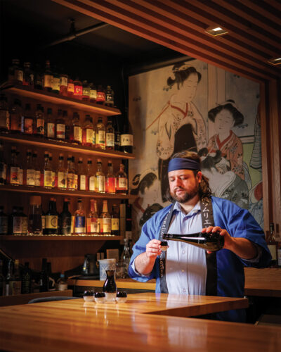 Master Sommelier Adam Boggeri at work pouring sake.
