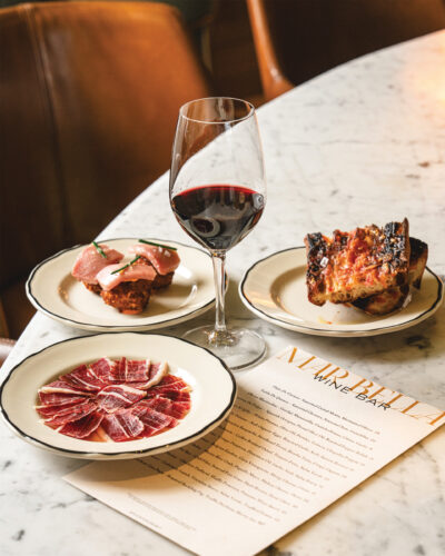 The pan con tomate, freshly carved Iberico jamón, and croquetas de jaiba from Mar Bella Boqueria.