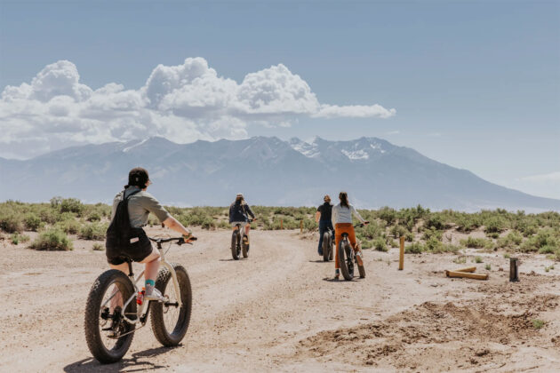 People mountain biking at Ramble Camp.