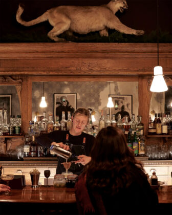 Bartender pours drink at The Western Hotel and Spa.