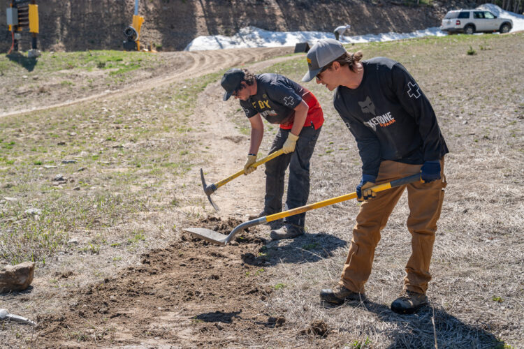 People clean up the trails for summer at Keystone Resort.