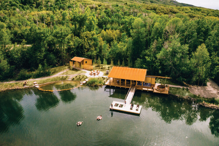 People relax in inner-tubes in a lake at Smith Fork Ranch.