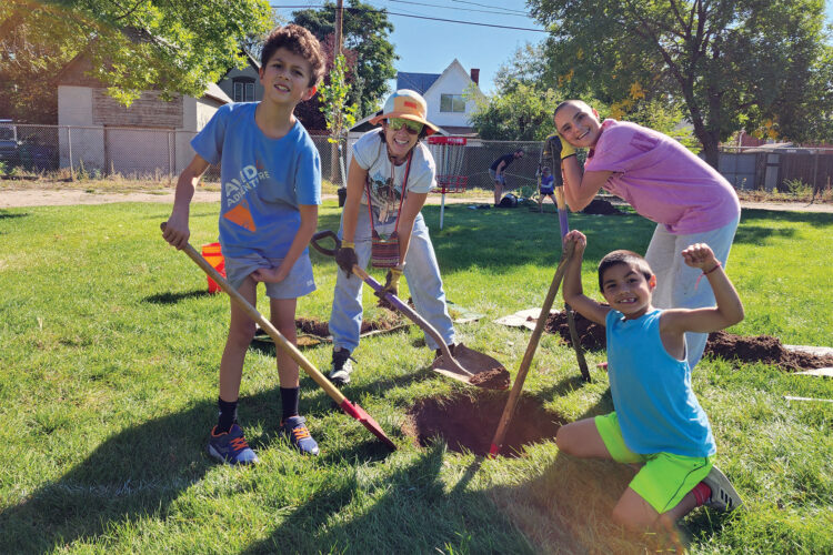 Children dig in garden at The Park People.
