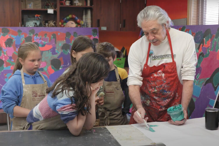 Children learn painting from a teacher at Think 360 Arts for Learning.