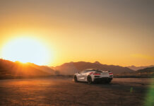 The 2026 Chevrolet Corvette Lineup Redefines American Muscle The 2026 Chevrolet Corvette parked in front of the mountains at sunset.