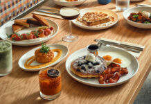 Selection of dishes on a table at Paperboy Denver.