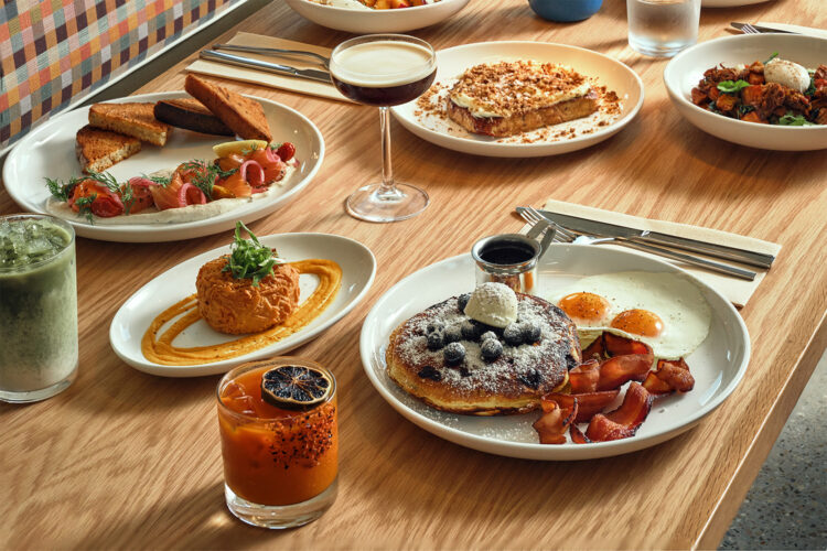 Selection of dishes on a table at Paperboy Denver.