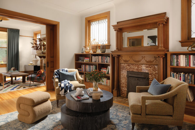 Living room with fireplace in the Denver Square home designed by Atelier.