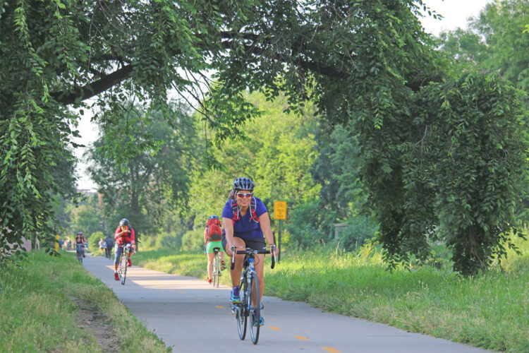People biking in a Denver park.