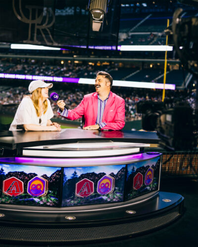Brady O’Neill hosting the in-game entertainment at Coors Field during a Rockies game.