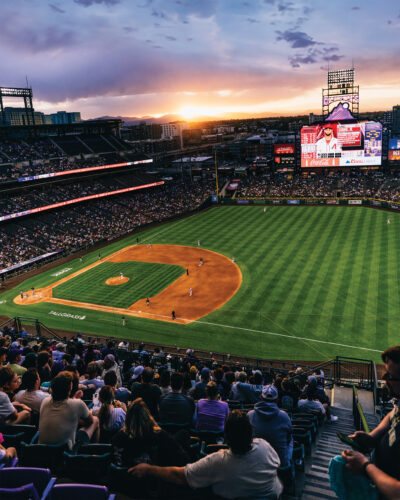 Wide shot of Coors Field at sunset.