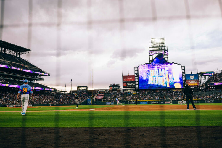 Player walks across the field after a home run.