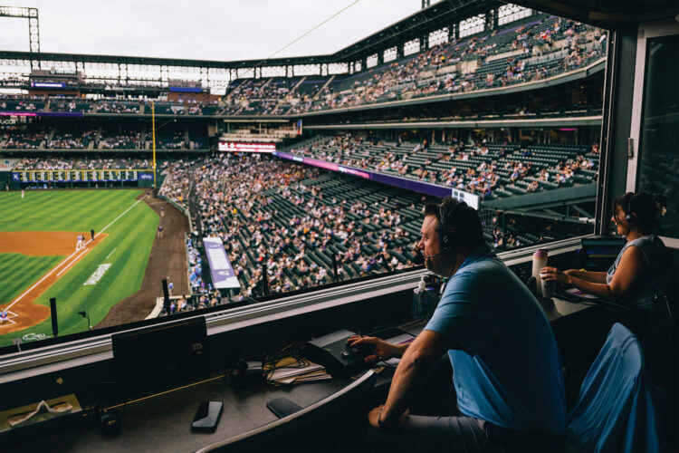 PA announcer Reed Saunders takes in the view from his perch above Coors Field.