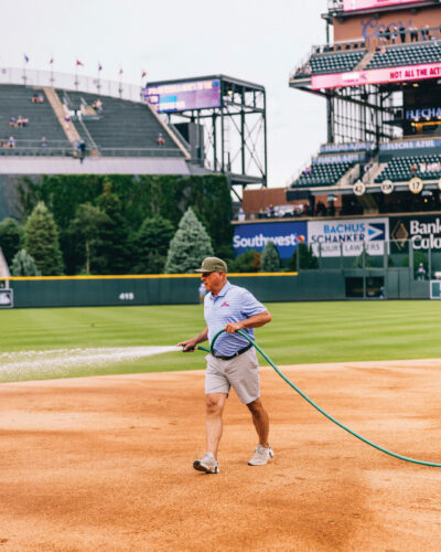 Mark Razum hoses down the diamond at Coors Field.
