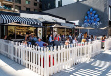 Patio surrounded by white picket fence at Forget Me Not.