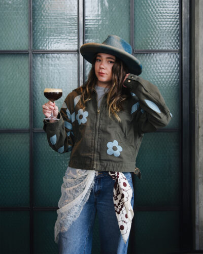 Woman poses in a jacket from Parrott Paints.