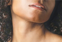 ISUN Skincare Takes On Colorado Sun and Thin Air Woman poses while rubbing skincare on her chest.