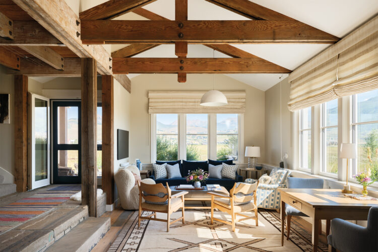 Interior living area with high beamed ceilings the Crested Butte home designed by Emily Tucker.