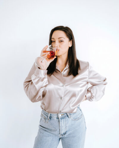 Model poses while drinking Mom Juice.