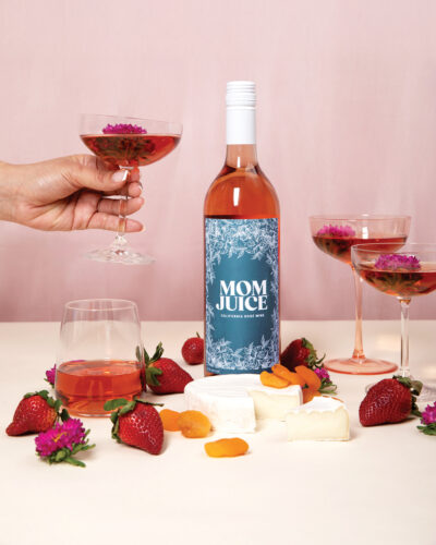 Product shot of Mom Juice in a bottle and glasses.