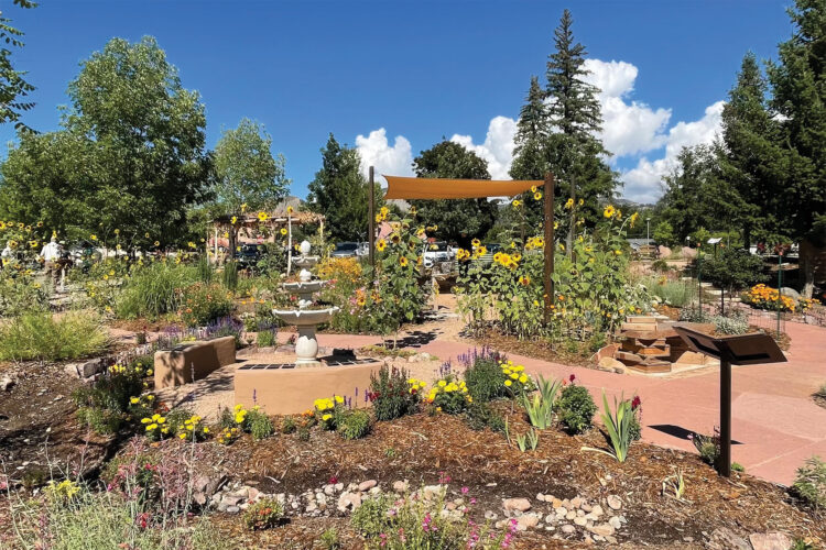 Garden with birdbath and canopy at Durango Botanic Gardens.