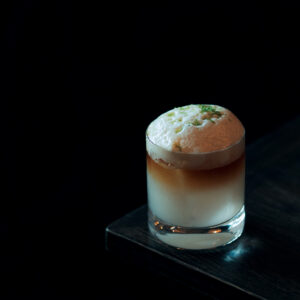The Little Hawaii cocktail with passionfruit honey foam and lime zest on top from Van Atta Telluride.