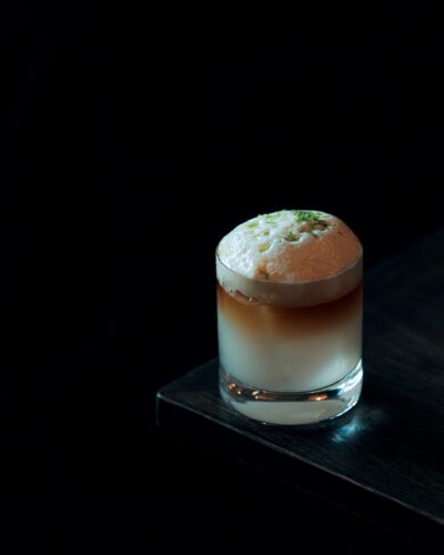 The Little Hawaii cocktail with passionfruit honey foam and lime zest on top from Van Atta Telluride.