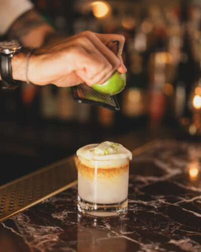 Lime is zested onto the Little Hawaii cocktail at Van Atta Telluride.