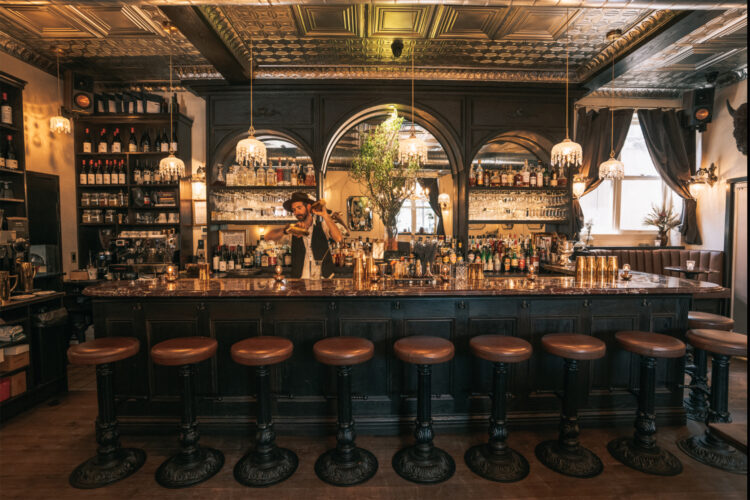 The bar with arching bar back at Van Atta Telluride.