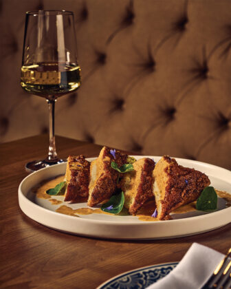 A dish with wine from the 2026 Colorado Chefs feature.