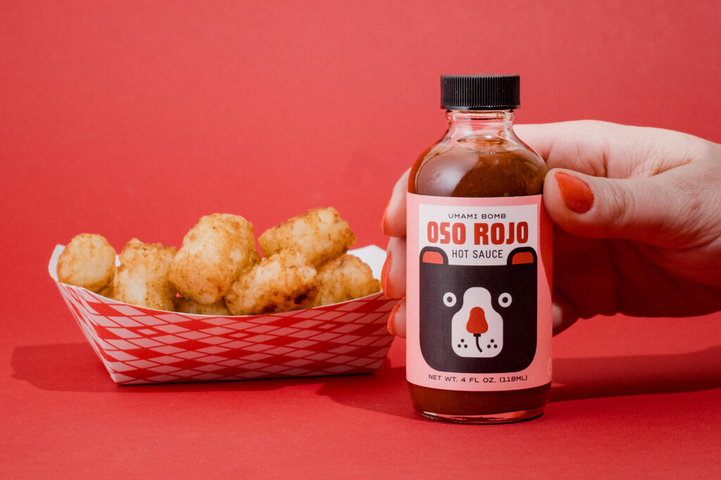 Oso Rojo Hot Sauce and tater tots.