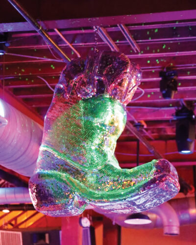 The giant disco cowboy boot at Belles and Boots, created by Abstruse.
