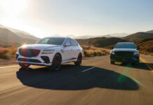 The 2026 Genesis GV80 Looks Better than Ever Two 2026 Genesis GV80 SUV's race alongside each other on an open road.