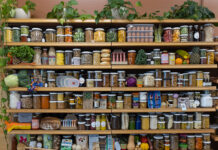 Jarred products line the shelves at Nude Foods Market.
