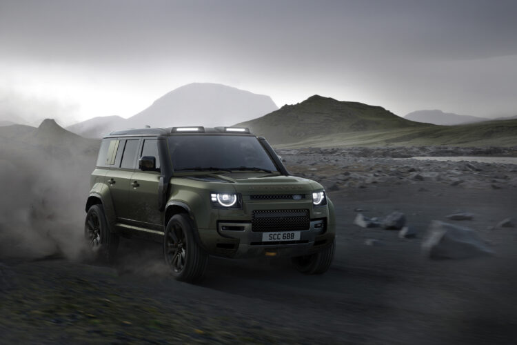The 2026 Defender 110 OCTA drives through rocky terrain. 