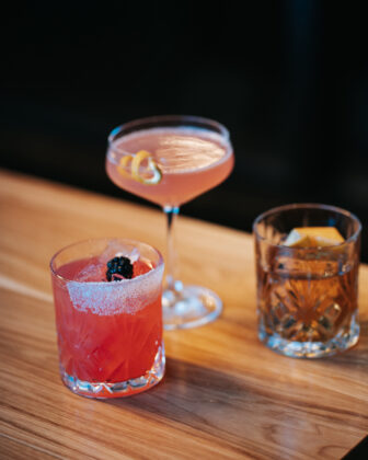 A collection of cocktails displayed on a table at The Blind Tiger.