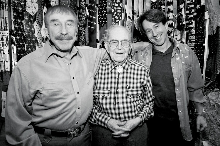 Black-and-white archival photo of three generations of the Weil family at Denver’s Rockmount Ranch Wear store.