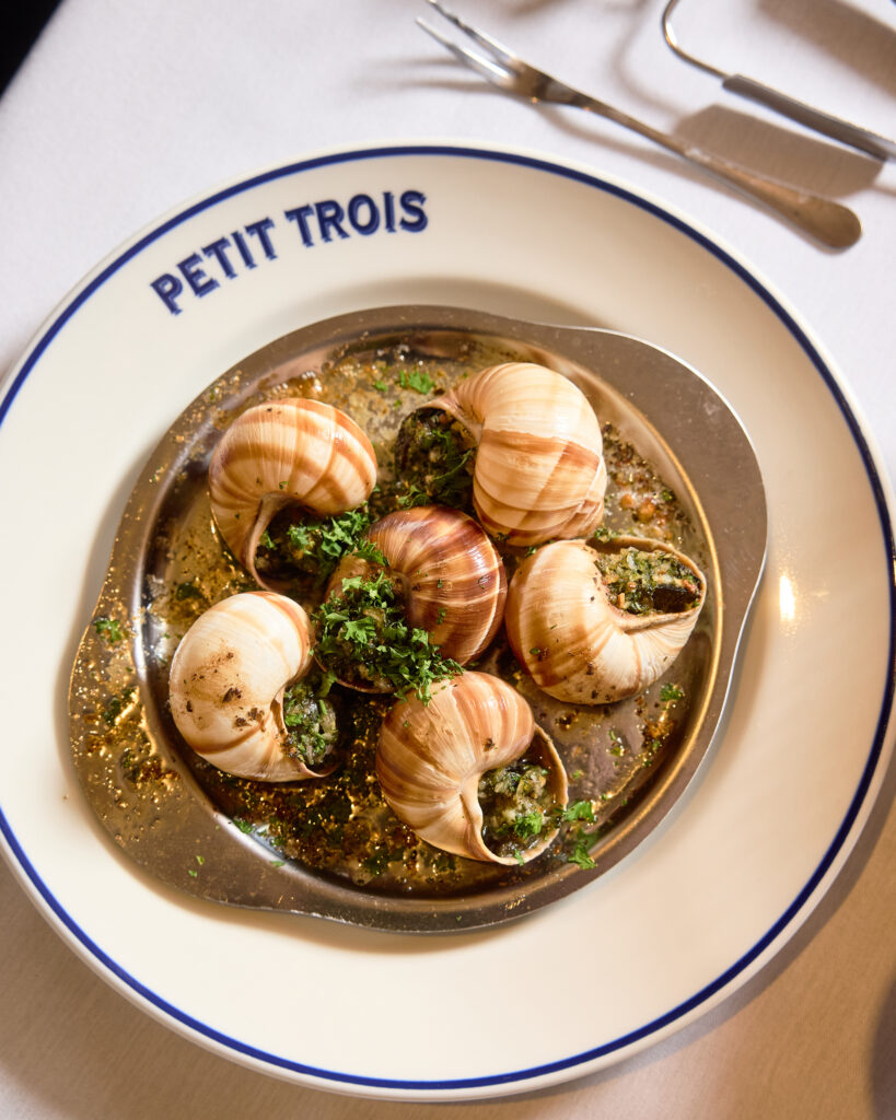 Escargot served in shells with herbs and butter at Petit Trois Aspen.