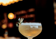 A Fresh Pour at Petit Trois Aspen Petit Trois Aspen’s pear cocktail in a coupe glass with a small floral garnish.