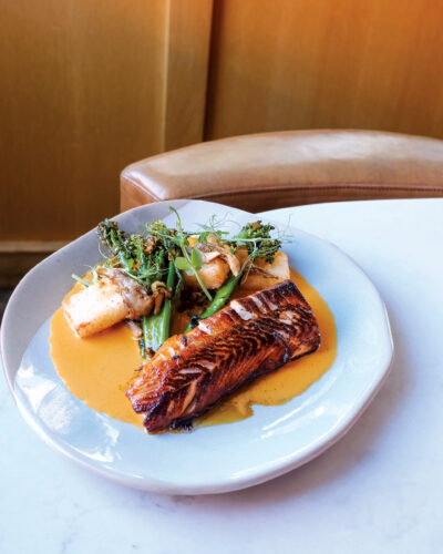 Urban Farmer's Seared Black Cod sits on a table ready to eat.