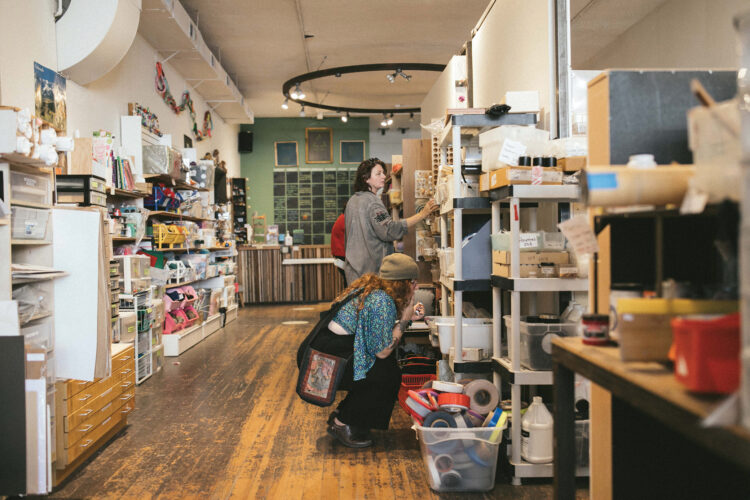 Shoppers browsing shelves of secondhand art and craft supplies at ReCreative Denver.