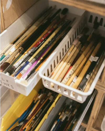Used paintbrushes sorted into baskets at ReCreative Denver.