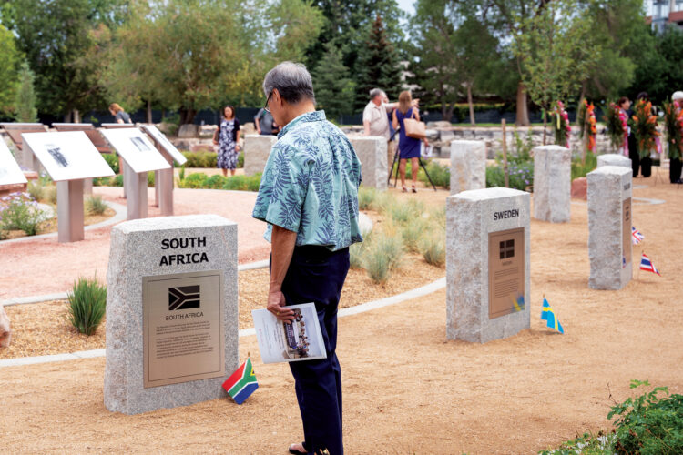 Visitors explore stone markers honoring participating nations at Aurora’s Korean War Veterans Memorial.
